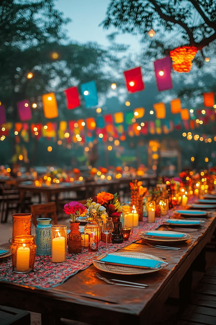 Friends laughing and enjoying dinner and wine under warm pendant lighting in a cozy restaurant